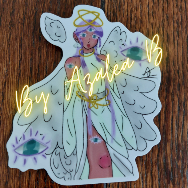 Sticker of an angelic figure with 'By Azalea B' text on a wooden surface