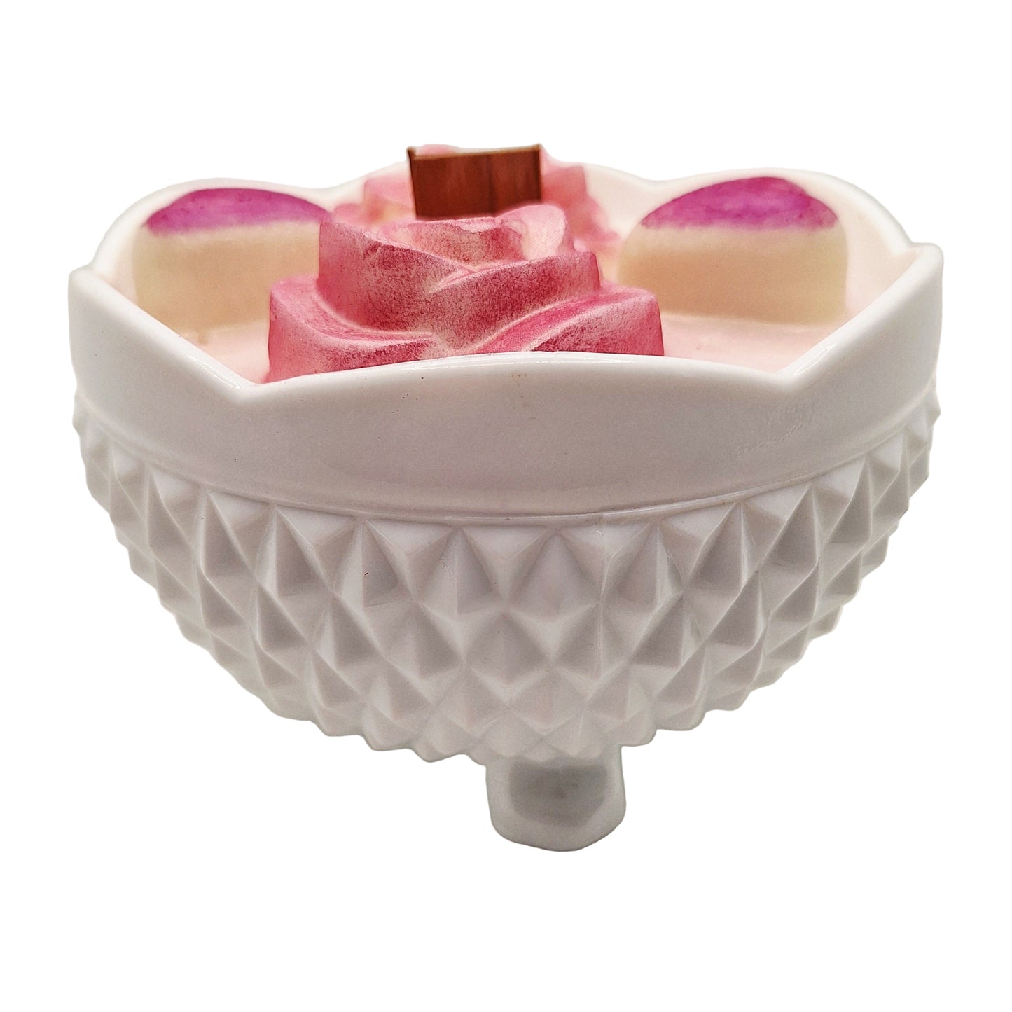 White textured bowl with pink and white layered soap on a white background