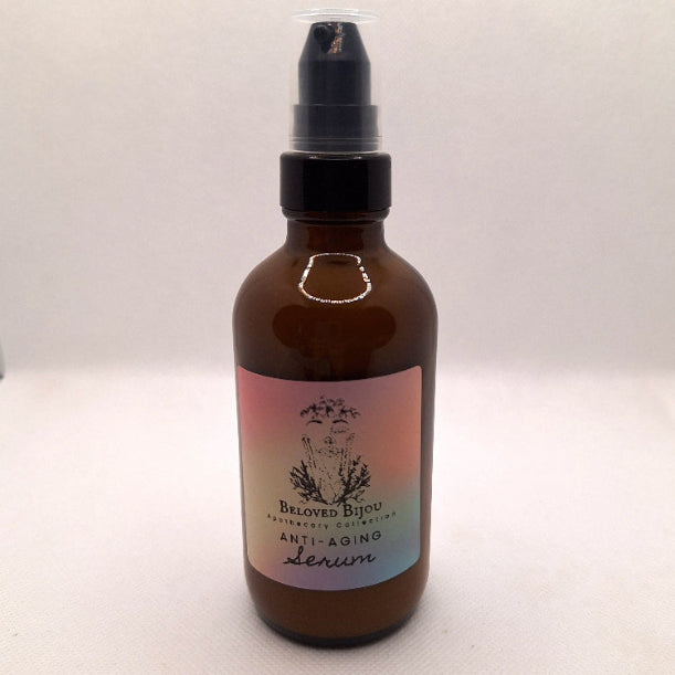 Brown glass serum bottle with a label on a white background