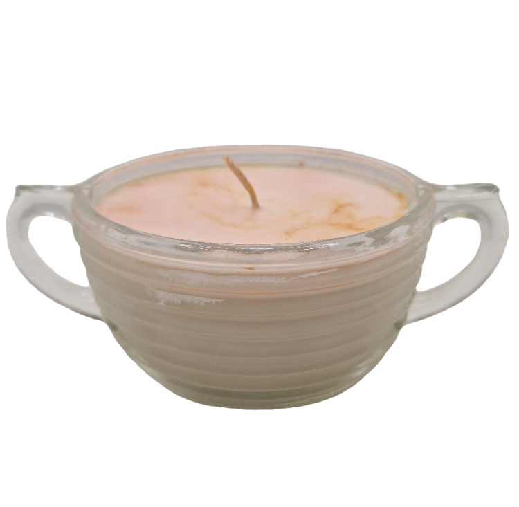 Candle in a glass holder with handles on a white background