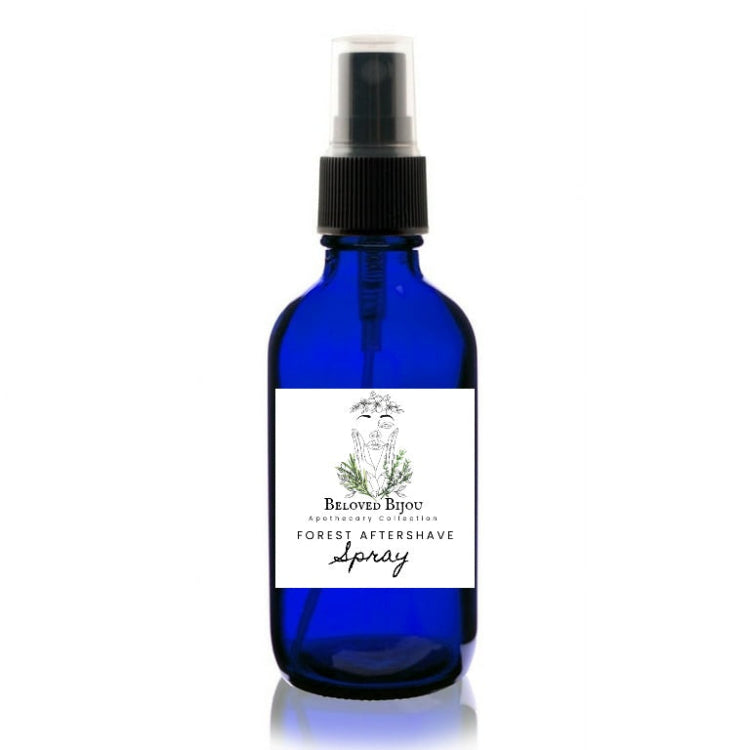 Blue bottle of forest aftershave spray with a white label on a white background