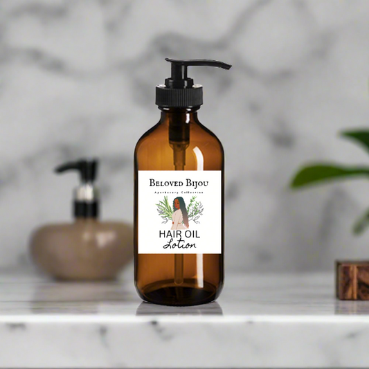Brown bottle of hair oil lotion with a label on a marble surface