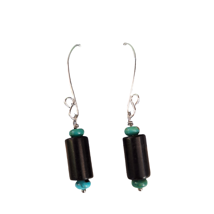 Pair of black cylindrical earrings with turquoise beads on a white background