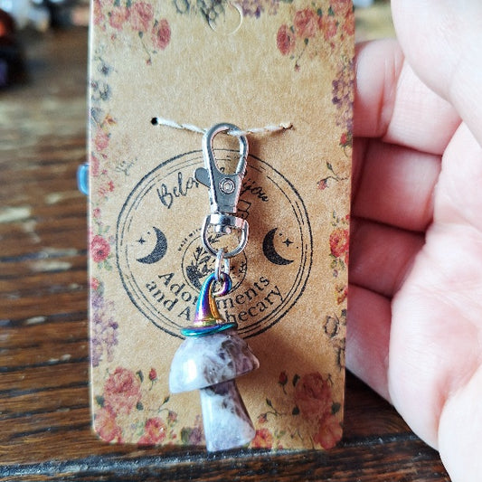 Mushroom-shaped crystal charm with a multi chrome witch hat on a floral card