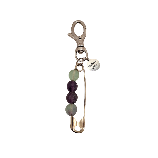 Keychain with safety pin and beads on a white background