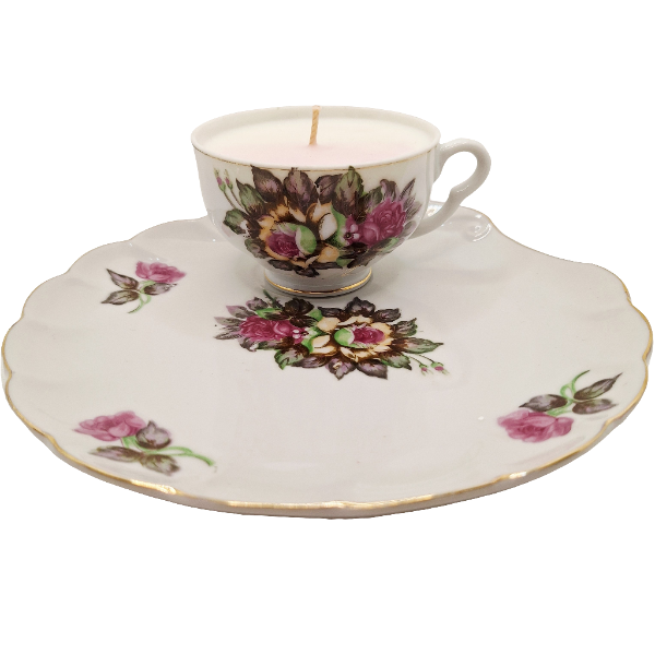 Teacup and saucer with floral design on a white background