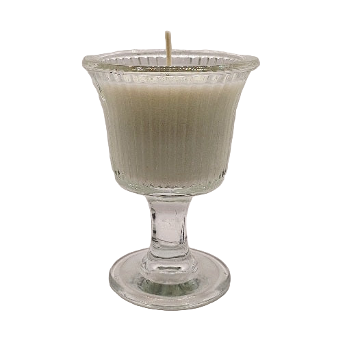 Candle in a clear glass holder on a white background