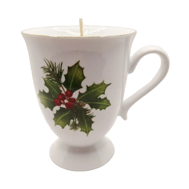 White mug with holly design on a white background