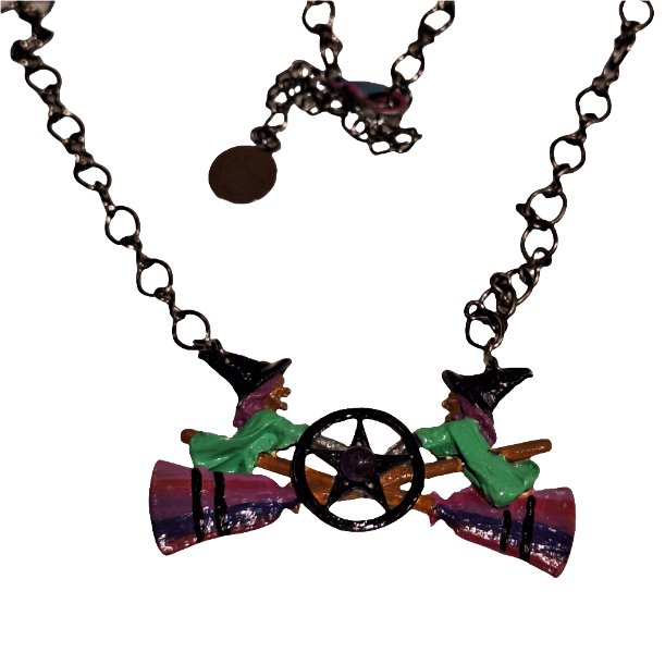 Necklace with colorful witch boot and hat pendant on a white background