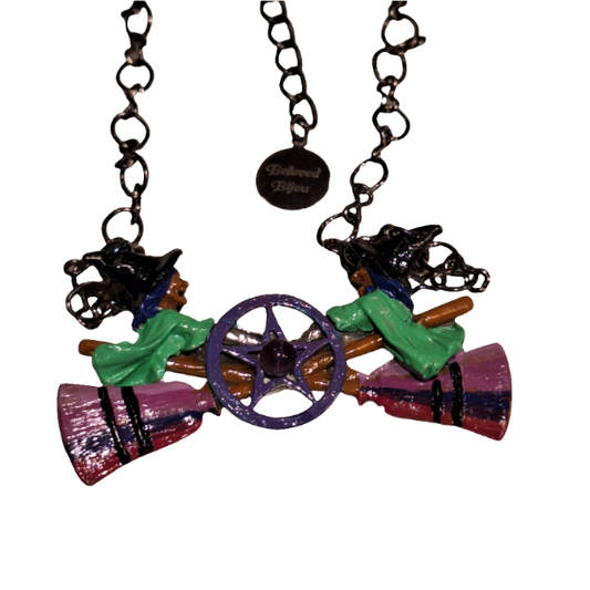 Colorful necklace with star-shaped pendant on a white background