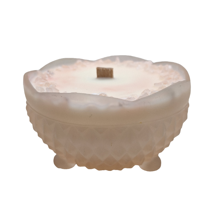 Frosted glass bowl with scalloped edge on a white background