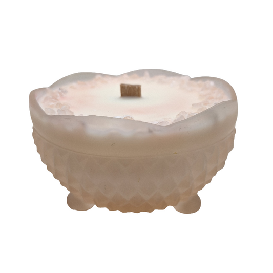 Frosted glass bowl with scalloped edge on a white background